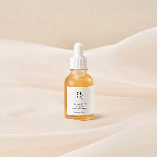 Stylised image of serum sitting on top of a bed of sheets