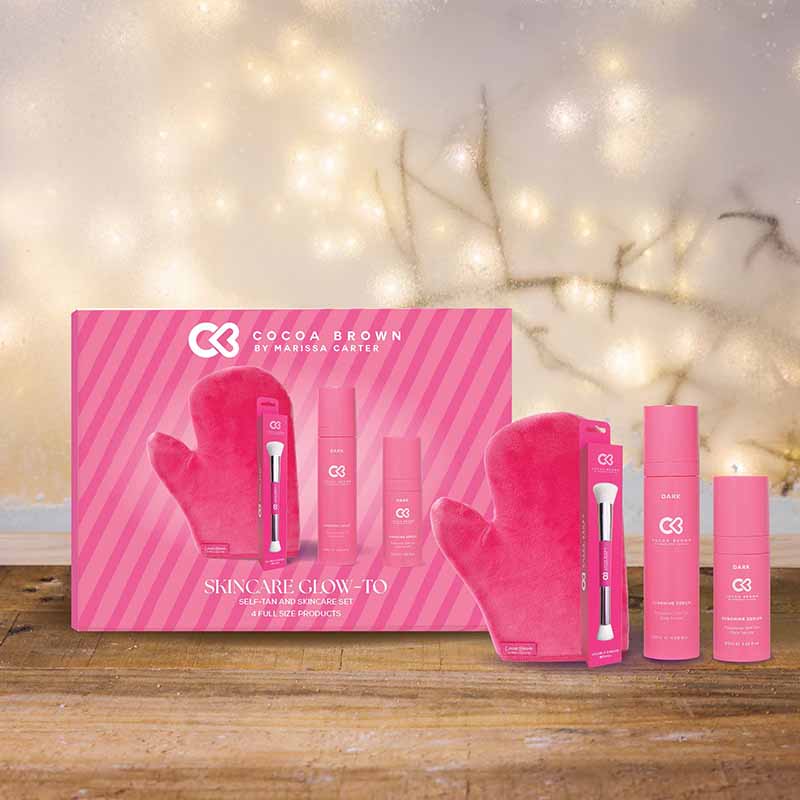 Cocoa Brown Skin Care Glow-To Self Tan Gift Set Sitting On A Wooden Shelf