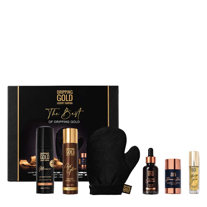 Dripping Gold hair treatment gift set featuring a black and gold presentation box, a black treatment bottle, a gold-capped treatment bottle, a black glove, a dark amber dropper bottle, a copper-toned cap, and a small gold-capped vial, arranged on a white background.