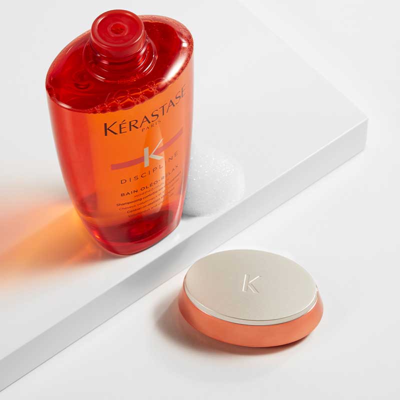 Kérastase Discipline Bain Oleo Relax Control-In-Motion Shampoo | tames unruly, voluminous hair | controls frizz, enhances shine, and improves manageability | leaves hair moisturized and supple | simplifies styling.