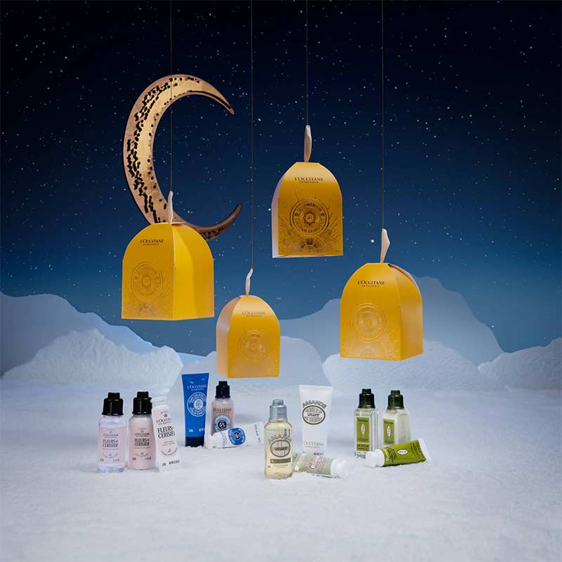L'OCCITANE Christmas Ornaments Range With Products In A Night Sky Scene