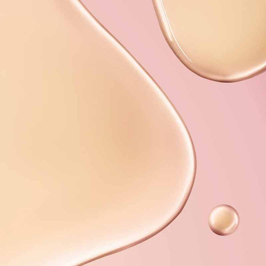 NUXE Huile Prodigieuse Florale Multi-Purpose Dry Oil texture of the oil from the product over a pink table