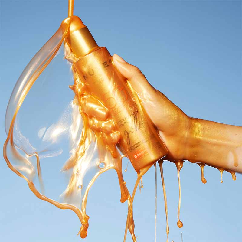 NUXE Sun Oil Gold Shimmery High Protection SPF 50 Stylised Image