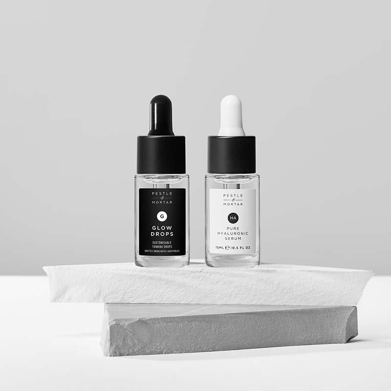 Pestle & Mortar | Hydrate & Glow Kit | Glow Drops (15ml) | Pure Hyaluronic Serum (15ml) | hydrates skin | plumps skin | natural sun-kissed glow | hydrating | customisable tan | travel-sized | skincare routine