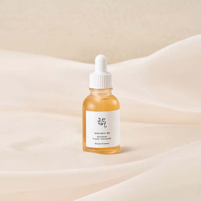 Stylised image of serum sitting on top of a bed of sheets