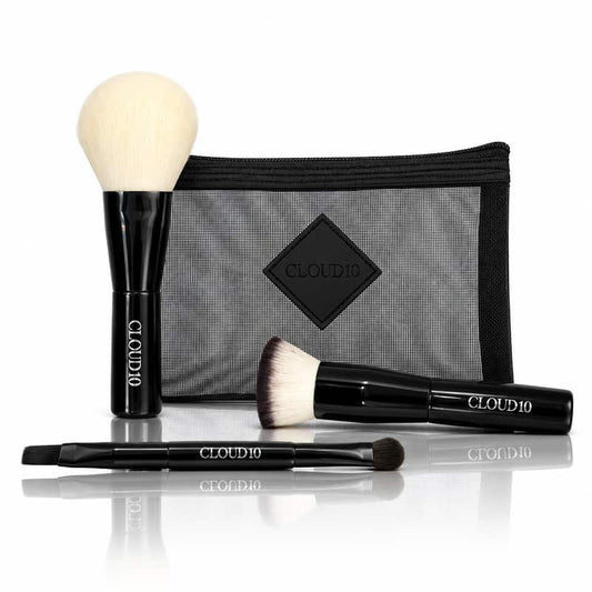 Cloud 10 On the Go Travel Brush Set with three black-handled makeup brushes and mesh makeup bag on a white background