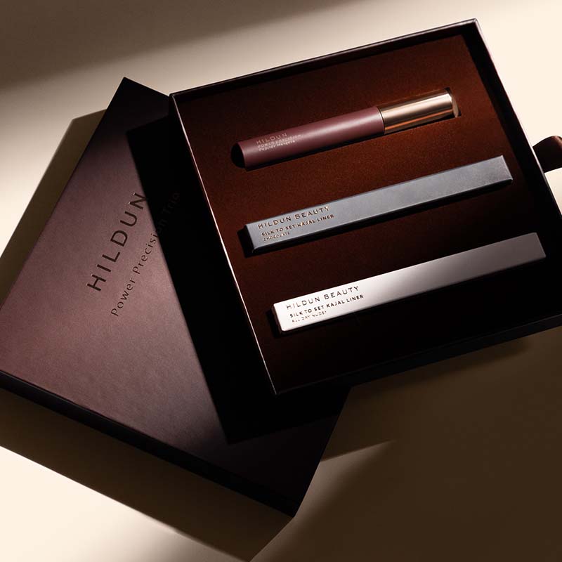 Hildun Beauty Power Precision Set Noir Makeup Gift Set image of box opened up with a glimmer of light shining on the products