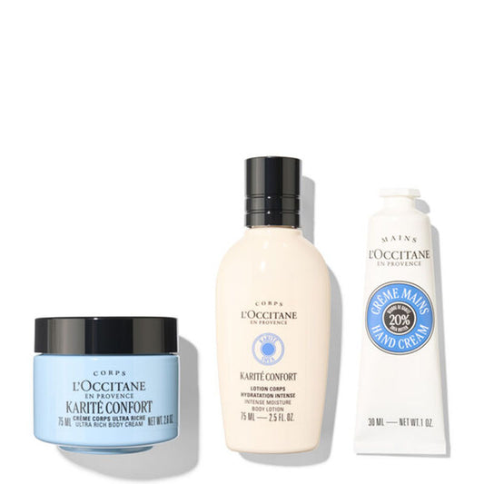 Three L'Occitane en Provence hand and body care products on a white background: a light blue jar of Karite Confort ultra rich body cream, a beige bottle of Karite Confort lotion body, and a white tube of Creme Maine Hand Cream.