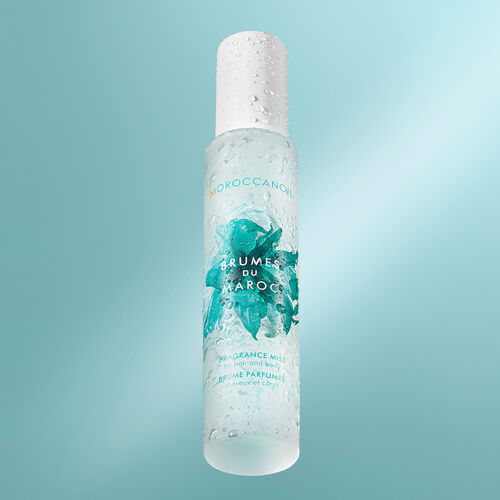 Moroccanoil Brumes du Maroc Hair and Body Mist blue background image with droplets of water on the bottle stylised image