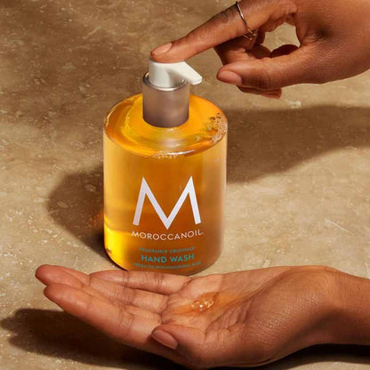 Moroccanoil Hair and Hand Heroes Original Gift Set Hair Wash being pumped into a hand
