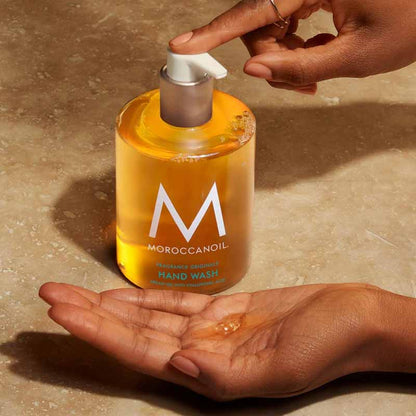 Moroccanoil Hair and Hand Heroes Light Gift Set hand wash being pumped into a hand
