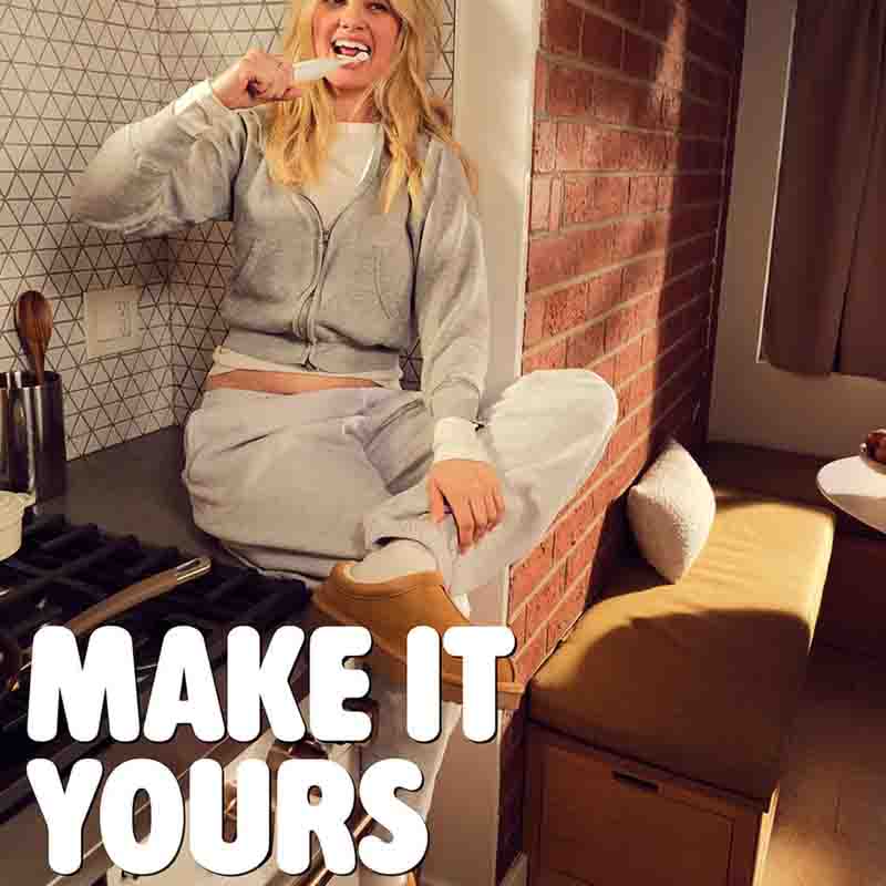 Spotlight Oral Care Sonic One Toothbrush White Woman brushing her teeth in the kitchen with on text saying make it yours