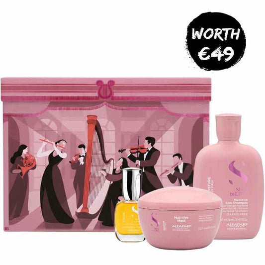 A pink alfaparf gift set featuring a large illustrated pink box with musicians, a pink shampoo bottle, a pink body butter jar, and a small yellow perfume bottle, with a black circular badge reading 'WORTH €49' in the top right.