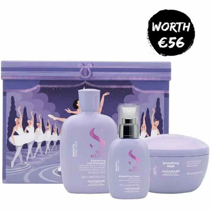 A lavender-colored AIFARJ professional haircare set featuring a smoothing line shampoo bottle, a smoothing curl spray bottle, and a smoothing mask jar, arranged in front of a matching illustrated purple gift box. A black circular badge in the top right corner reads 'WORTH €56'.