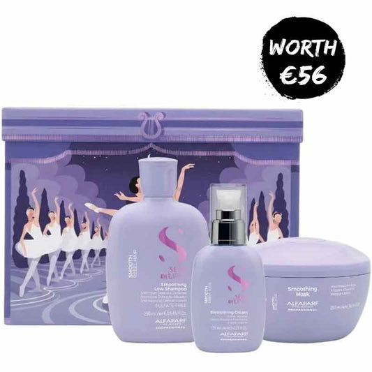 A lavender-colored AIFARJ professional haircare set featuring a smoothing line shampoo bottle, a smoothing curl spray bottle, and a smoothing mask jar, arranged in front of a matching illustrated purple gift box. A black circular badge in the top right corner reads 'WORTH €56'.