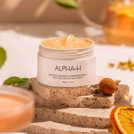 Alpha-H Melting Moment Cleansing Balm | buttery soft cleansing balm | Wild Orange Extract | face cleanser | makeup remover | Australian Sandalwood Seed Oil | Vegan | Cruelty-free | balm-to-oil cleanser
