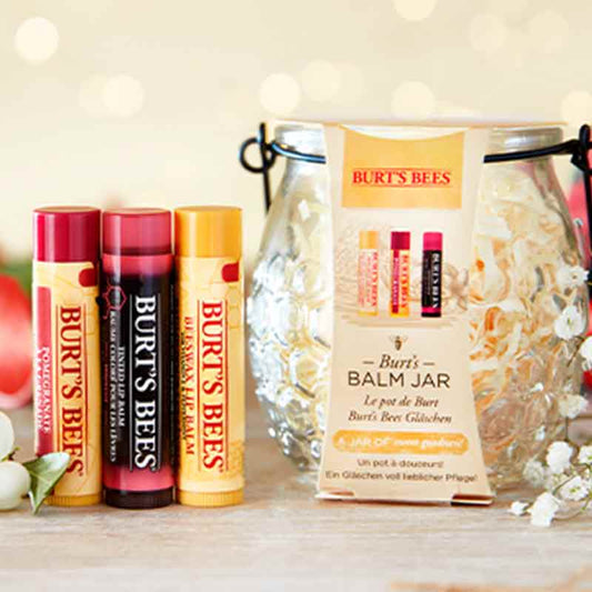 Burt's Bees Burt's Balm Jar Gift Set With Three Lip Balms In A Honey Jar Stylised Image With Flowers
