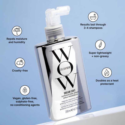 A bottle of Color Wow Dream Coat Super Natural Spray shown on a light blue background with feature callouts around it. The bottle is metallic silver with a clear pump and large black 'W' lettering.