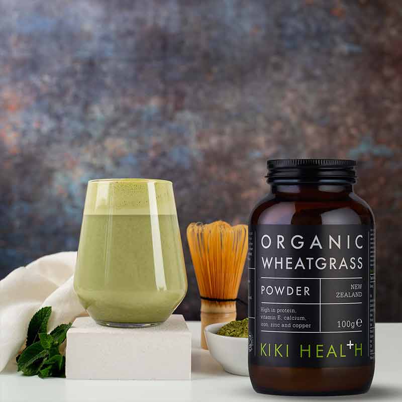 KIKI Health Organic Wheatgrass Powder In a glass