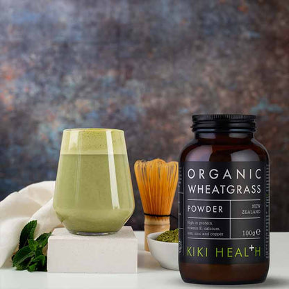 KIKI Health Organic Wheatgrass Powder In a glass