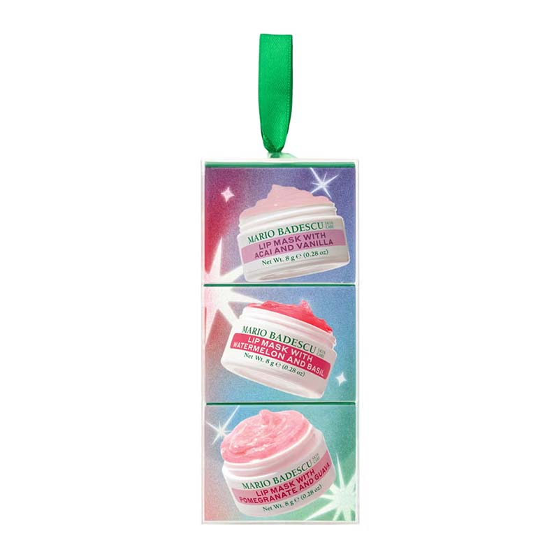 Mario Badescu holiday ornament featuring three stacked jars of lip care cream with a green ribbon loop at the top, set against a plain white background.
