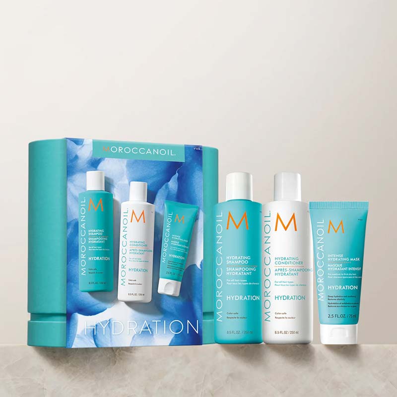 Morocconoil Hydrating Kit Box With Products On A Marble Shelf With Neutral Background Wall