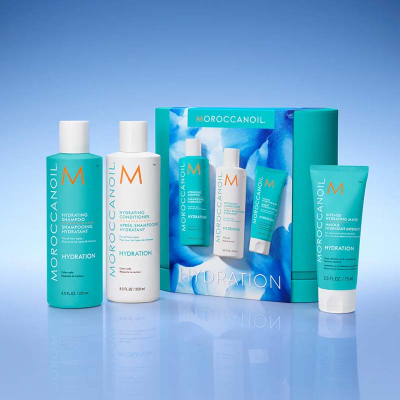 Morocconoil Hydrating Kit Box With Products In A Blue Studio Background