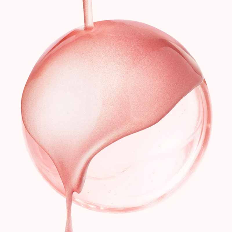 NUXE Huile Prodigieuse Floral Gold Shimmer Multi-Purpose Dry Oil image of the shade and texture of the product dropping over a glass sphere