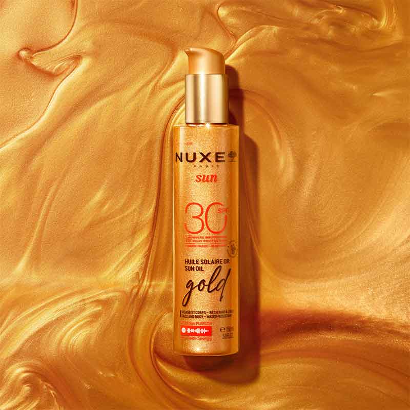 NUXE Sun Oil Gold Shimmery High Protection SPF 30 stylised image, NUXE Sun Oil Gold Shimmery High Protection SPF 30 texture