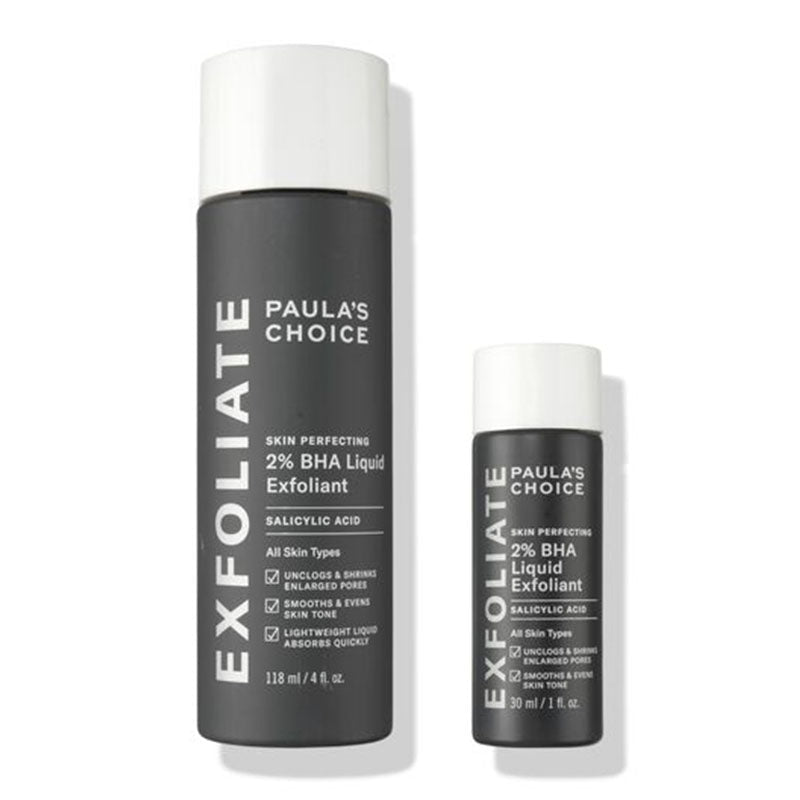 Paula's Choice Exfoliate 2% BHA Liquid Exfoliant shown in two sizes: a larger 110 ml bottle and a smaller 29 ml bottle, both in dark gray with white caps on a white background.