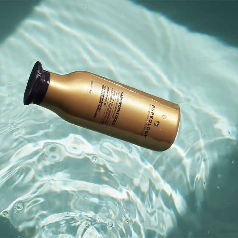 Pureology Nanoworks Gold Conditioner floating in water