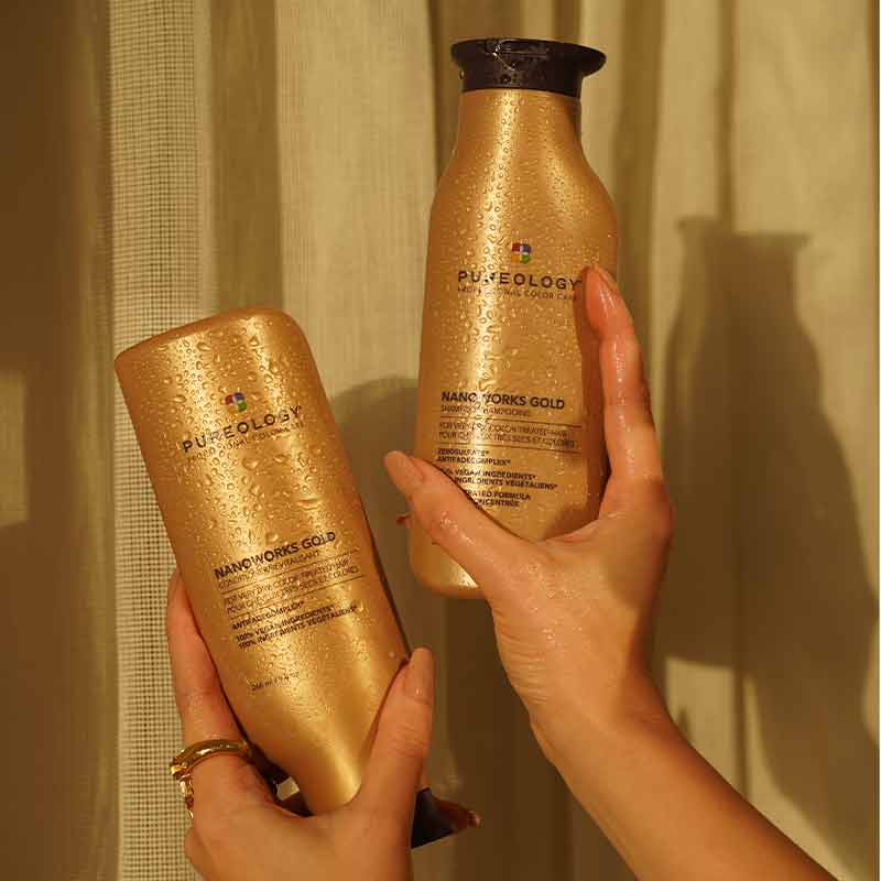 Pureology Nanoworks Gold Shampoo and Conditioner In hands
