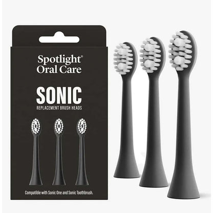 Spotlight Oral Care Sonic Toothbrush Replacement Heads Black pack and heads beside it 