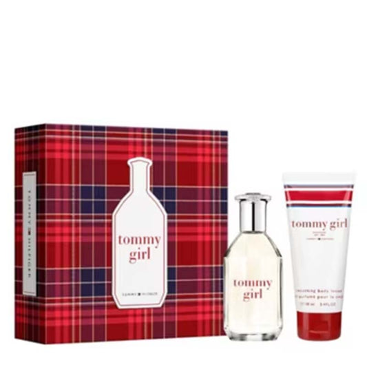 Tommy Girl fragrance gift set featuring a red and navy plaid box, a clear glass spray bottle with silver cap, and a white body lotion tube with red accents on a white background.