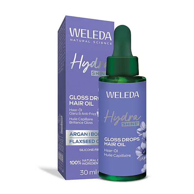 Weleda Hydra Shine Hair Oil product with packaging behind it white image