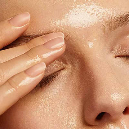 Weleda Make-Up Removal Cleansing Oil Bing used on a woman's face